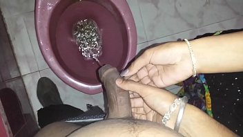 Bitch holding my dick while I piss